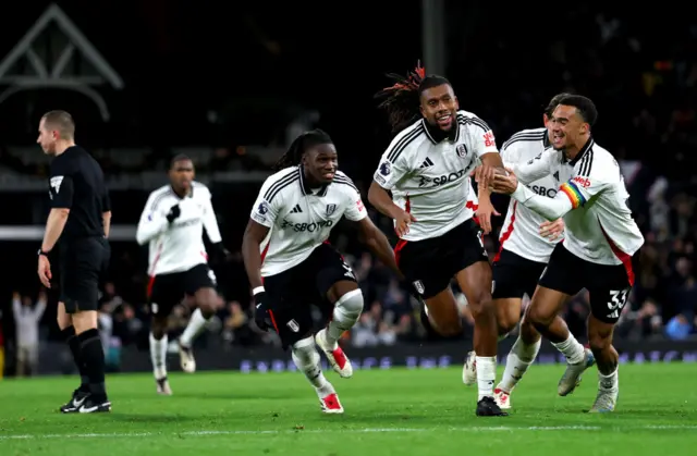 Iwobi runs off to celebrate with a smile on his face