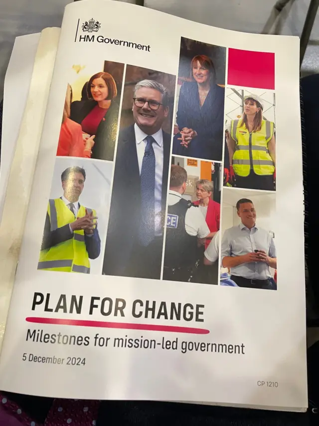 A photo of a booklet that reads: PLAN FOR CHANGE, Milestones for mission-led government