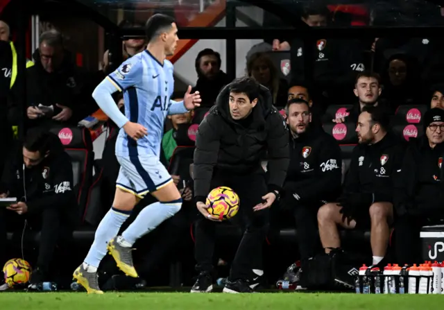 Iraola gathers the ball on the touchline