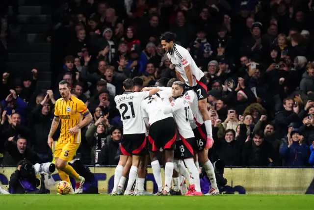 Fulham players cleebrate as Brighton players look dejected