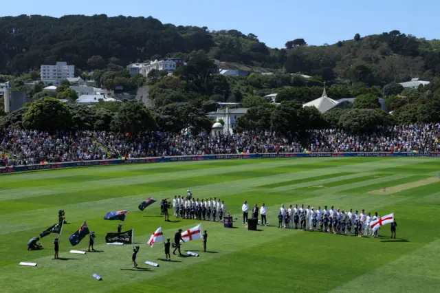 New Zealand and England players line up for the national anthems