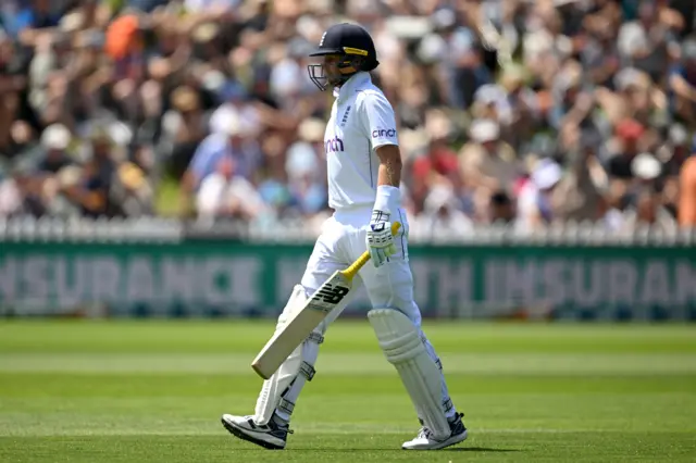 Joe Root walks off after being dismissed