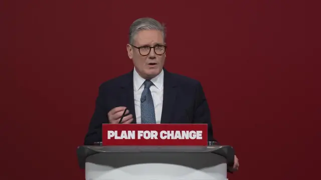 Keir Starmer delivers his Plan for Change speech in a suit behind a podium