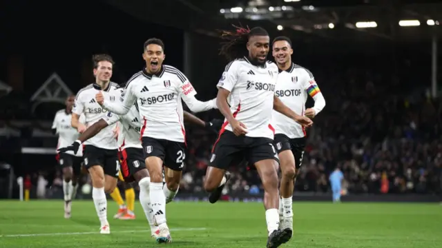 Ale Iwobi celebrates with teammates