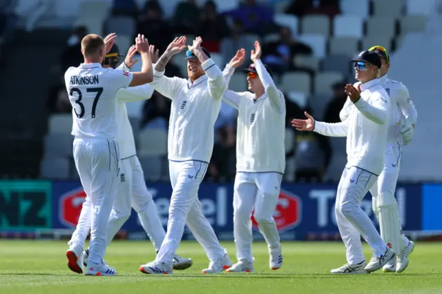 Gus Atkinson celebrates the wicket of Devon Conway