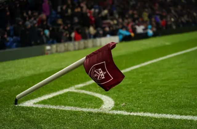 A general view of the corner flag being blown over by strong winds