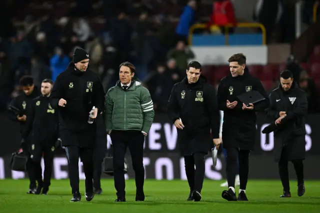 Scott Parker, Manager of Burnley, leaving the field with his backroom staff at half time at the Championship match