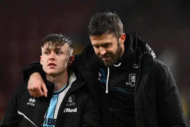 Michael Carrick, Manager of Middlesbrough (right), interacts with Ben Doak