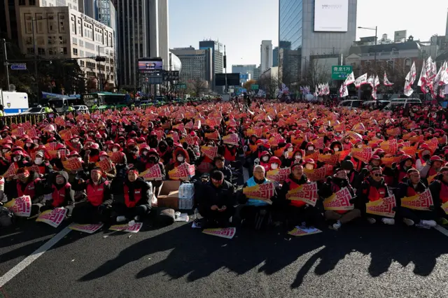 Protesters sitting on the ground