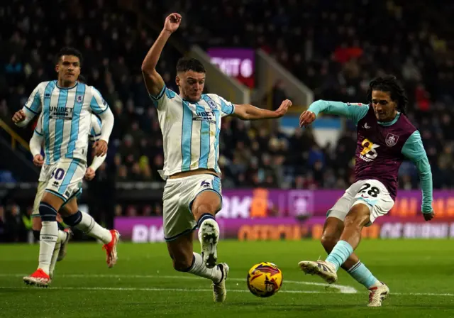 Burnley's Hannibal Mejbri (right) attempts a shot on goal