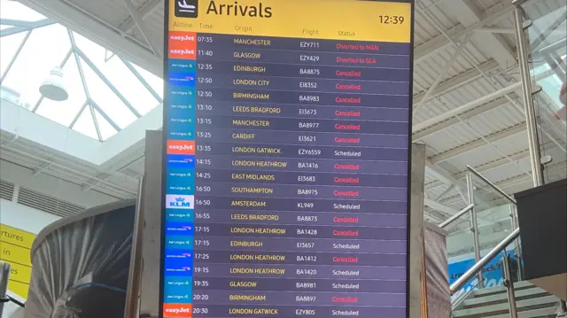 An arrivals board full of cancellations