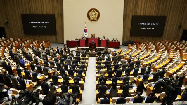 South Korean national assembly members in session as they vote for the impeachment of president yoon suk yeol