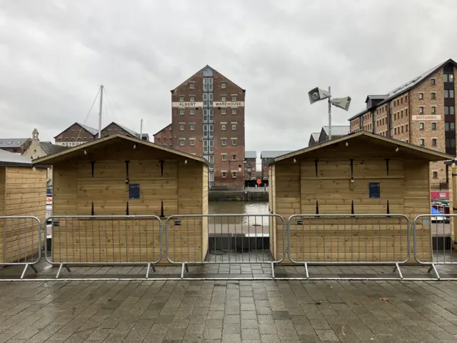 Two closed Christmas market stalls in Gloucester.