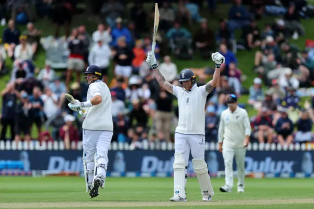 Ben Stokes celebrates Joe Root reaching his century