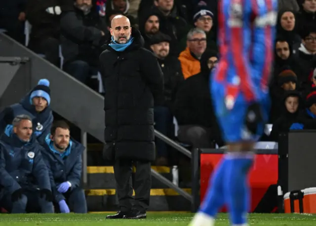 Pep Guardiola watches on