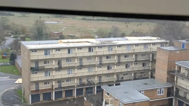 Panels blown off the roof of a block of flats