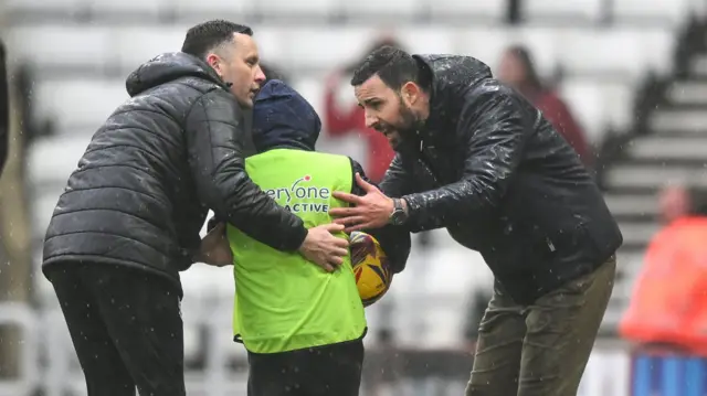 Narcis Pelach checks on a ballboy