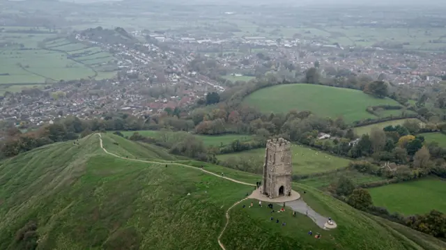 An aerial view of Glastonbury town and Tor