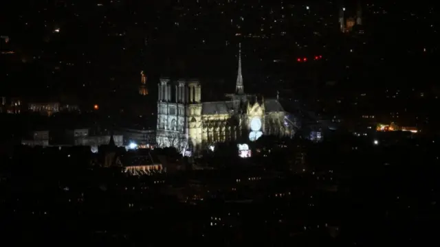 Notre-Dame by night stands out as the only heavily illuminated building in the Parisian night light