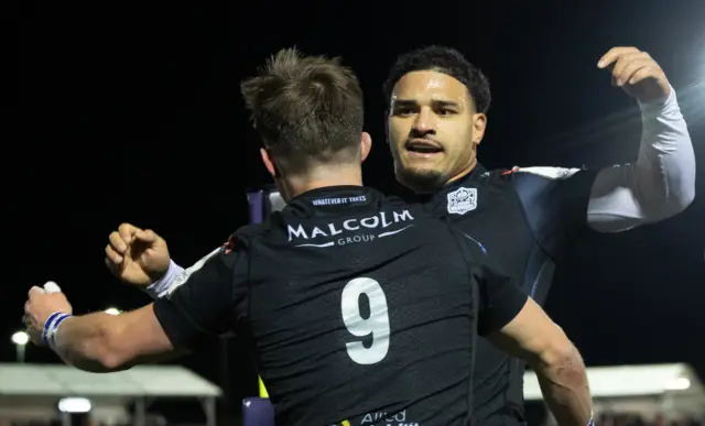 Sione Tuipulotu celebrates with George Horne