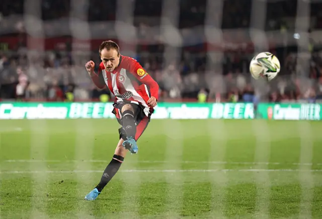 Mikkel Damsgaard of Brentford scores during the penalty shootout.