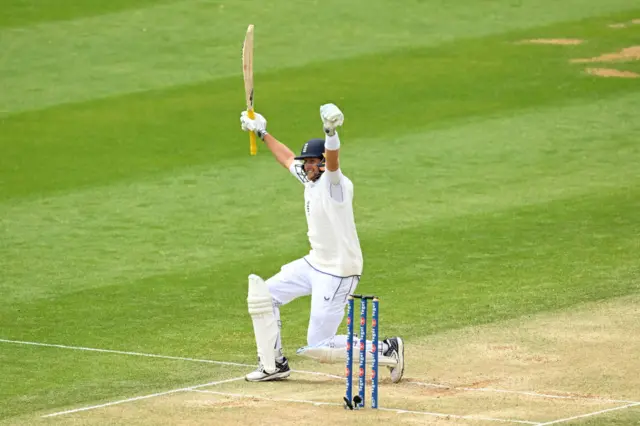 Joe Root celebrates reaching his century