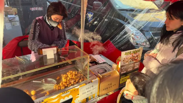 Vendors have set up food carts along the side streets