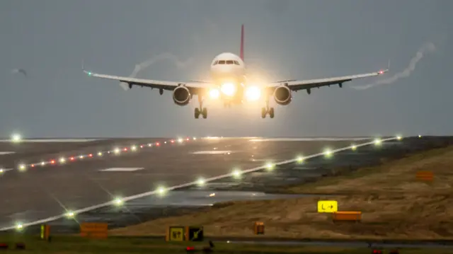 A plane landing onto the runway