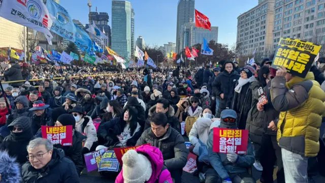 Protesters line the main avenue leading to parliament