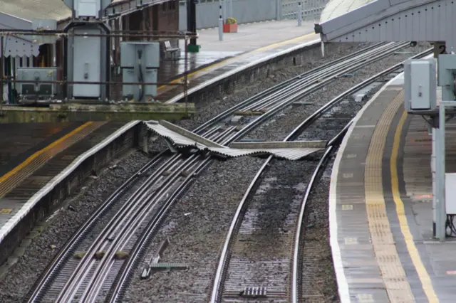 Debris on the train track from the canopy at Westbury station in Wiltshire.