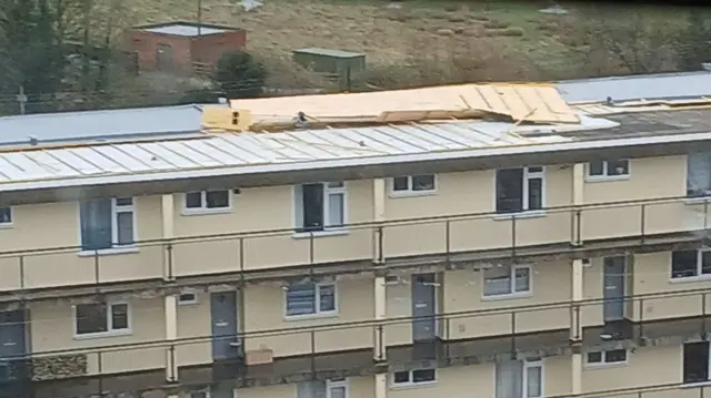 Panels blown off the roof of a block of flats