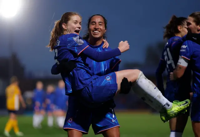 Chelsea's Sjoeke Nusken celebrates scoring their fourth goal with Mayra Ramirez