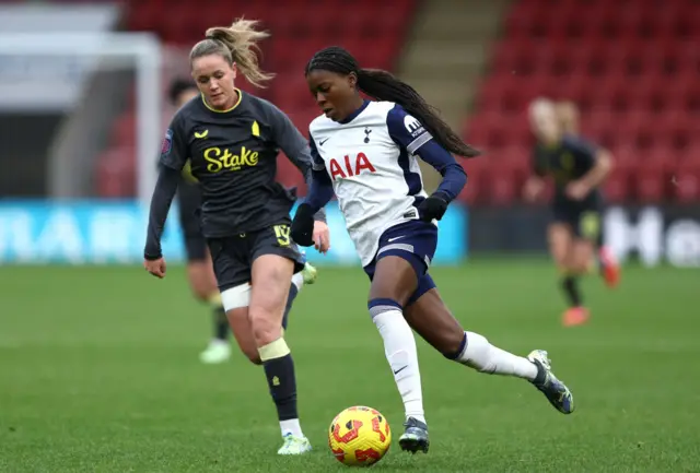 Jessica Naz of Tottenham Hotspur is put under pressure by Heather Payne of Everton