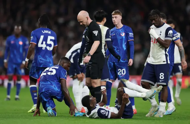 Tottenham Hotspur's Pape Matar Sarr reacts after sustaining an injury.