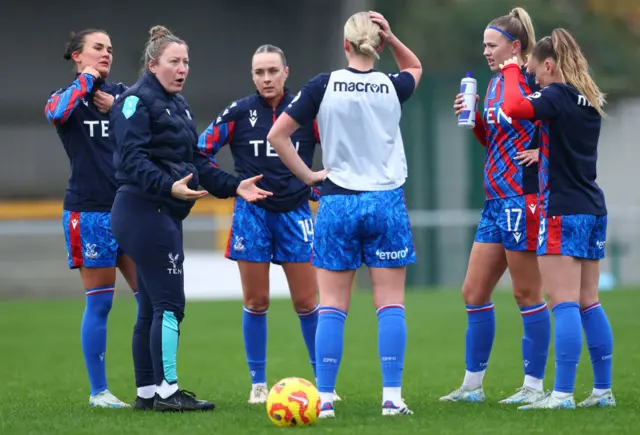 Kaminski speaks to her players during the warm up