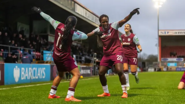 Manuela Pavi of West Ham United celebrates with Viviane Asseyi after scoring