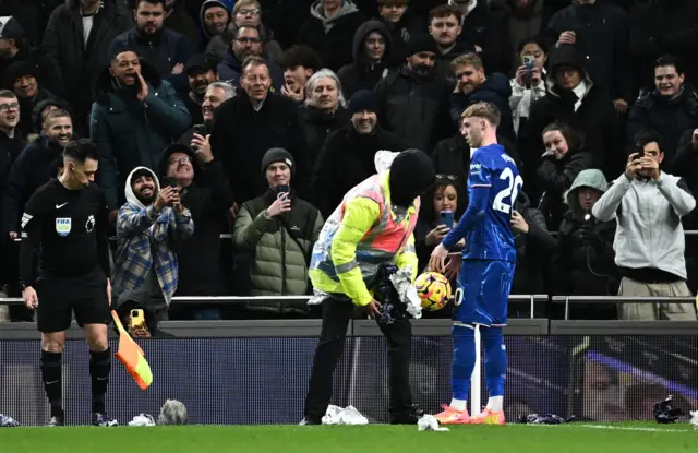 Paper is seen on the pitch which had been thrown on by fans.