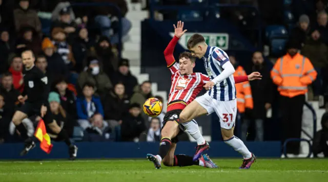 West Bromwich Albion's Tom Fellows (right) competing with Sheffield United's Harrison Burrows