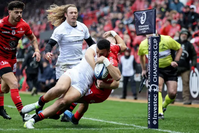 Matthis Lebel scores a try despite Stewart Moore's efforts