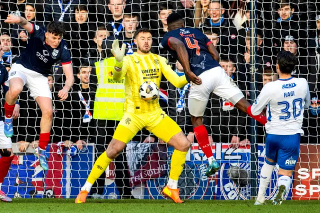 Akil Wright's header for Ross County is saved by Rangers goalkeeper Jack Butland