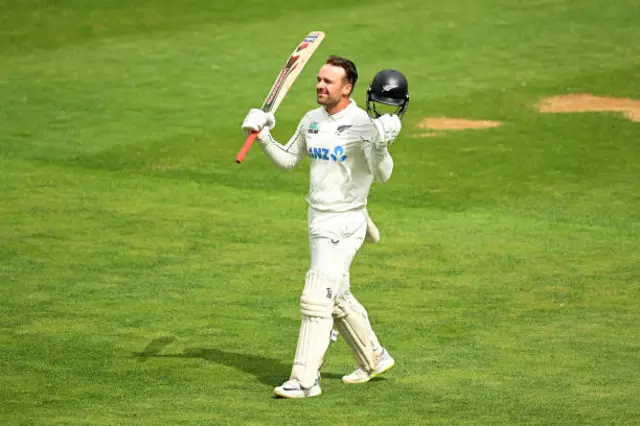 Tom Blundell celebrates after century