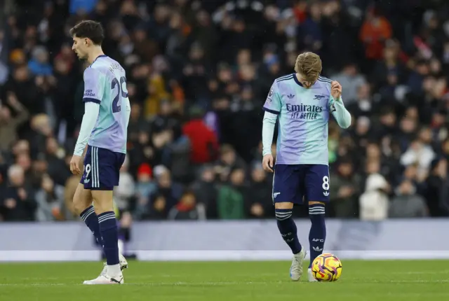 Arsenal's Martin Odegaard looks dejected.