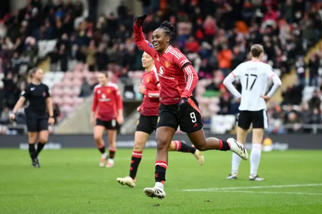 Melvine Malard of Manchester United celebrates scoring her team's fourth goal