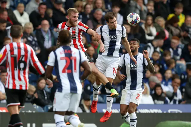 Oliver McBurnie of Sheffield United and Jayson Molumby of West Bromwich Albion