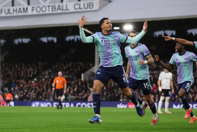 Arsenal's William Saliba celebrates scoring their first goal.