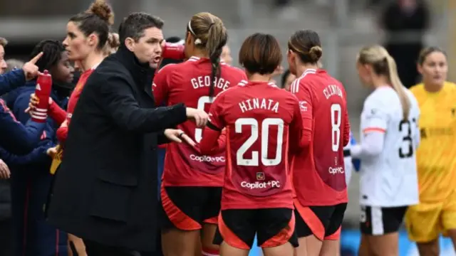 Marc Skinner, Manager of Manchester United, interacts with Hinata Miyazawa