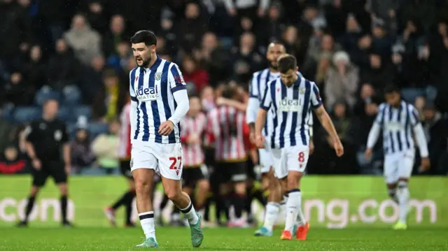 Alex Mowatt of West Bromwich Albion and team-mates are dejected after conceding a second goal