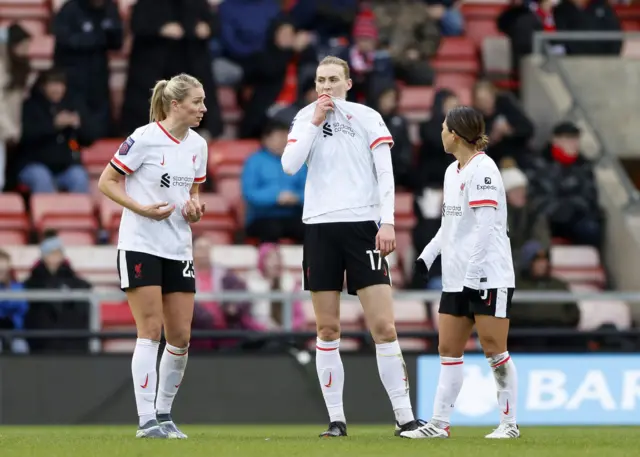 Liverpool's Gemma Bonner, Jenna Clark and Fuka Nagano appear dejected