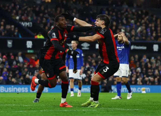 AFC Bournemouth's Dango Ouattara celebrates scoring their second goal with AFC Bournemouth's Milos Kerkez