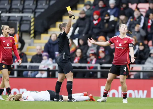 Manchester United's Maya Le Tissier reacts after being shown a yellow card